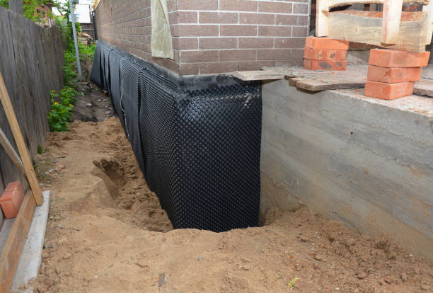 SJ Waterproofing Pros technician performing targeted Wet Basement Repair assessment in Totowa, NJ